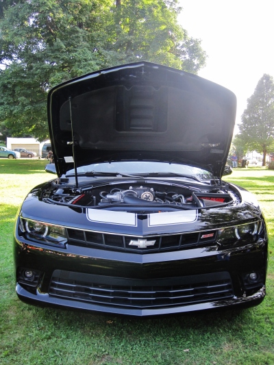 Front interior view of the 2013 Chevrolet Camaro's hood and engine on view for the 5th Annual Power In The Park Classic Car Show & 8th Annual Uncle Sam Jam, held at Power's Memorial Park in Troy,NY, Saturday, August 30, 2014. (c) Amy L. Modesti, 2014