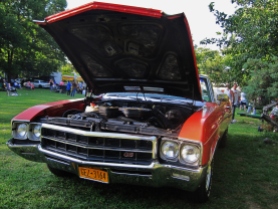 First frontal close up of the red-orange and white GS and its hood/engine on view in the 5th Annual Power In The Park & 8th Annual Uncle Sam Jam, held at Power's Memorial Park in Troy,NY, Saturday, August 30, 2014. (c) Amy L. Modesti, 2014