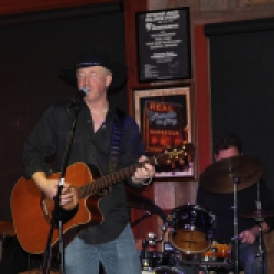 Charlie Morris from The Coveralls Band singing at his first live gig at the Dinosaur Bar-B-Que Restaurant in Troy, NY with his band members. Photo taken by Amy L. Modesti with the Canon Rebel SL1 on Friday, January 30, 2015. (c): Amy Modesti, 2015
