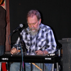 Slide guitarist/lap steel player, Kevin Maul, playing his lap steel with The Coveralls band at their first live gig at the Dinosaur Bar-B-Que Restaurant in Troy, NY. Photo taken by Amy L. Modesti with her Canon Rebel SL1 on Friday, January 30, 2015. (c): Amy Modesti, 2015