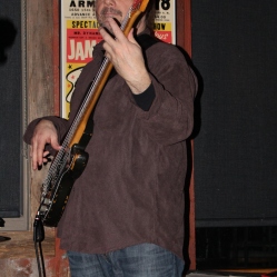The Coveralls bassist, Kyle Esposito, playing his bass guitar at his 1st live gig held at the Dinosaur Bar-B-Que Restaurant in Troy, NY. Photo taken by Amy L. Modesti with Canon Rebel SL1 on Friday, January 30, 2015. (c): Amy Modesti, 2015