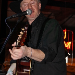 Guitarist/singer, Charlie Morris from The Coveralls Band, playing his guitar at his 1st live gig held at the Dinosaur Bar-B-Que Restaurant in Troy, NY. Photo taken by Amy L. Modesti with Canon Rebel SL1 on Friday, January 30, 2015. (c): Amy Modesti, 2015