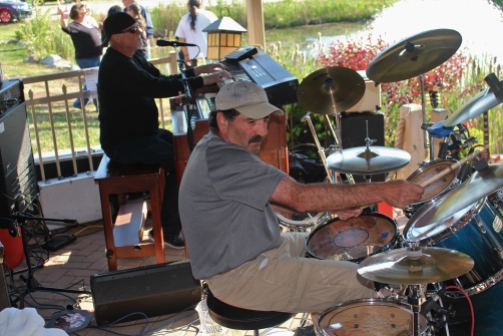 E.B. JEB Band pianist, Barry Jones, and drummer, Mike Miranda, performing together live at The Mil Of Round Lake, located in Round Lake, NY. Photo taken by Amy L. Modesti on Saturday, May 23, 2015 with Canon Rebel SL1 Digital SLR Camera. (C): Amy Modesti, 2015.