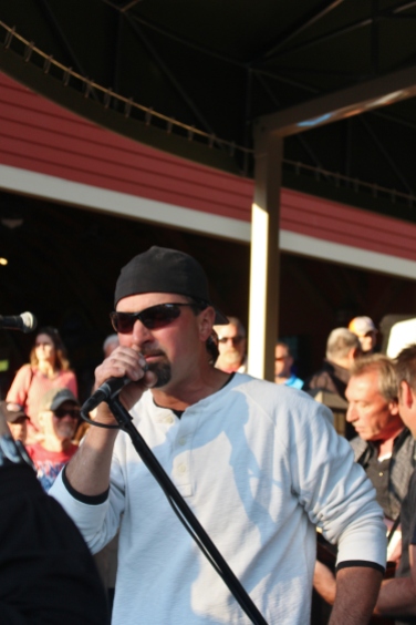 E.B. JEB Band Lead singer/tambourine player, Dan Hinman, singing a song during his band's third set at The Mill Of Round Lake, located in Round Lake, NY.Photo taken by Amy L. Modesti on Saturday, May 23, 2015 with Canon Rebel SL1 Digital SLR Camera. (C): Amy Modesti, 2015