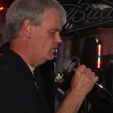 Ted Henessey, vocalist & harmonica player, performing with the Matt Mirabile Band during his band's first set at Casey Finn's Pub Grill LLC in Albany, NY. Photo taken by Amy L. Modesti on Friday, May 22, 2015 with her Canon Rebel SL1 Digital SLR Camera. (C): Amy Modesti, 2015
