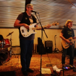 "Big Frank and the Bargain Bingers" featuring Bob Resnick (drums), Frank Novko (bass guitar), and a local guitarist, performing at "Still: DQ 2 For Dick Quinn" concert held at The Hangar in Troy, NY, Sunday, October 11, 2015. Series 7/10. Photo taken by Amy L. Modesti with her Canon Rebel SL1 Digital SLR Camera. (C): Amy Modesti, 2015
