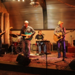 "The Coveralls" Featuring Kyle Esposito (bass guitar), Peter Bearup (electric guitar), Bob Resnick (drums), Kevin Maul (lap steel), and Charlie Morris (acoustic guitar) performing at "Still: DQ 2 For Dick Quinn" concert held at The Hangar in Troy, NY, Sunday, October 11, 2015. Series 4/17. Photo taken by Amy L. Modesti with her Canon Rebel SL1 Digital SLR Camera. (C): Amy Modesti, 2015