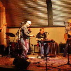 "The Coveralls" Featuring Kyle Esposito (bass guitar), Peter Bearup (electric guitar), Bob Resnick (drums), Kevin Maul (lap steel), and Charlie Morris (acoustic guitar) performing at "Still: DQ 2 For Dick Quinn" concert held at The Hangar in Troy, NY, Sunday, October 11, 2015. Series 15/17. Photo taken by Amy L. Modesti with her Canon Rebel SL1 Digital SLR Camera. (C): Amy Modesti, 2015