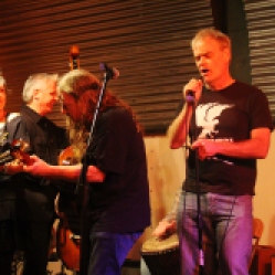The DoorNellies Featuring Peggy Lecuyer, Gene Lemme (upright bass), Mike McMann (acoustic guitar), and Ted Hennessey (harmonica/vocals) performing at "Still: DQ 2 For Dick Quinn" concert held at The Hangar in Troy, NY, Sunday, October 11, 2015. Series 1/15. Photo taken by Amy L. Modesti with her Canon Rebel SL1 Digital SLR Camera. (C): Amy Modesti, 2015