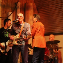 The "Tichy Boys" Featuring a bassist, John Tichy (guitar/vocals), Johnny Rabb (vocals), and a local drummer performing at "Still: DQ 2 For Dick Quinn" concert held at The Hangar in Troy, NY, Sunday, October 11, 2015. Series 7/19. Photo taken by Amy L. Modesti with her Canon Rebel SL1 Digital SLR Camera. (C): Amy Modesti, 2015