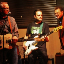 The "Tichy Boys" featuring John Tichy (guitar/vocals), drummer, Johnny Rabb (vocals), and Graham Tichy (guitar/vocals) performing at "Still: DQ 2 For Dick Quinn" concert held at The Hangar in Troy, NY, Sunday, October 11, 2015. Series 1/19. Photo taken by Amy L. Modesti with her Canon Rebel SL1 Digital SLR Camera. (C): Amy Modesti, 2015